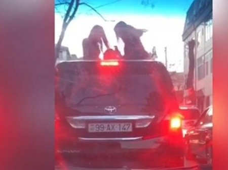 Bakıda müzakirələrə səbəb olan daha bir "3 qız VİDEOSU" - Maşının üstünə çıxıb...